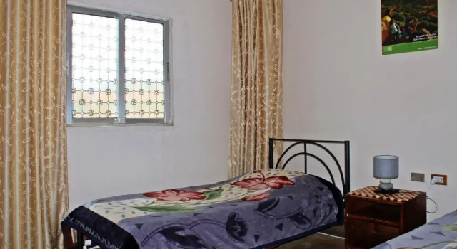 Кровать в общем номере Rocky Mountain Hotel Jordan