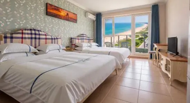 Кровать в общем номере с видом на море Preferred Meisu Seaview Apartment (Dongdaihe Shanhai Tongwan Branch)