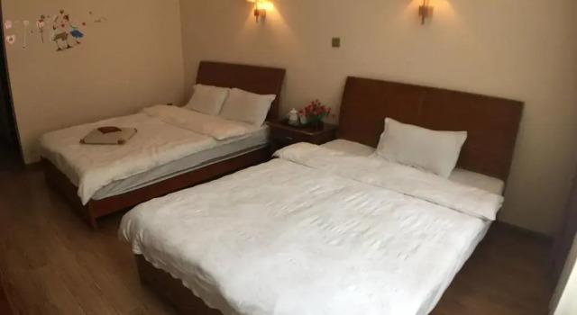 Yaju Happy Guest House, Prenota Affittacamere Dali Yunnan