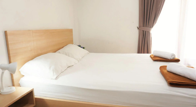 Кровать в общем номере Mk House Tendean