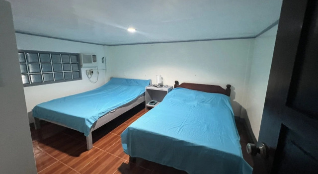 Кровать в общем номере RedDoorz at Lao Singuan Homestay