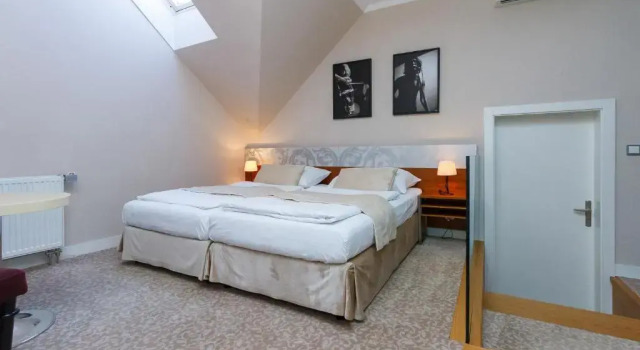 Clássico quarto Hotel Aplaus