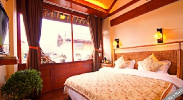 Lijiang Gucang Inn, Забронировать Отель Лицзян Юньнань, рядом с Улица Сквер-стрит Древнего города Даянь
