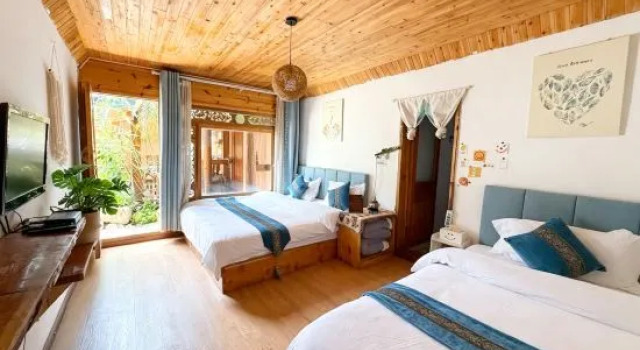 Кровать в общем номере Qiuniang House Lugu Lake