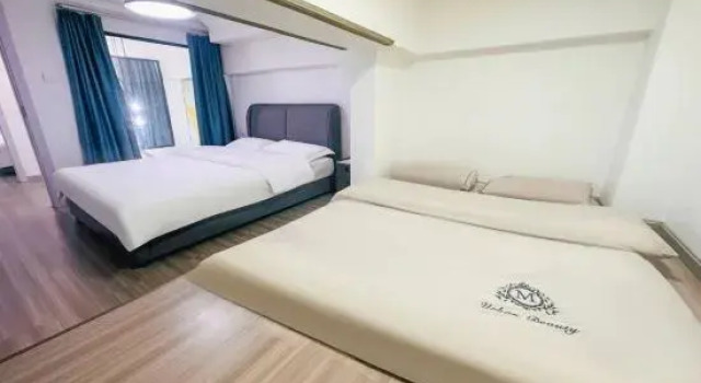 Люкс с 2 комнатами Yijiu Apartment (Kunming Railway Station Shuangqiao Night Market Style Street)