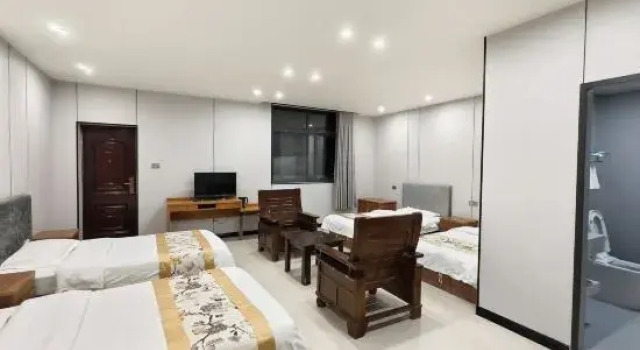 Кровать в общем номере Huashan Gehui Hotel