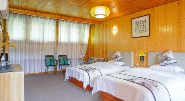 Кровать в общем номере Fanjing Mountain Spring House Homestay