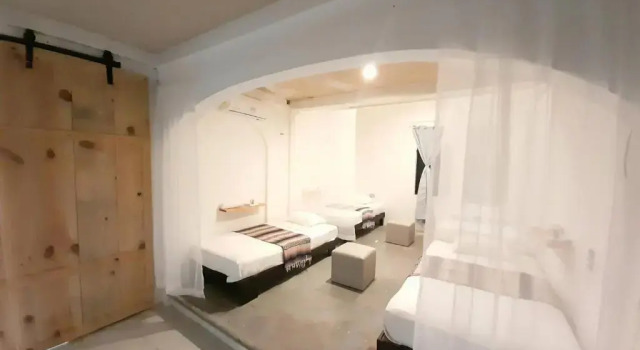 Кровать в общем номере Casa Iguana hostel