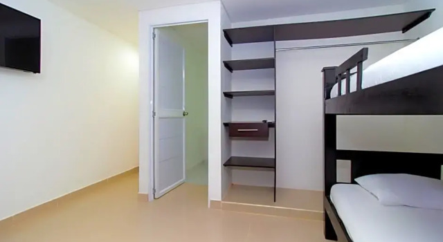 Кровать в общем номере Playa Norte Hotel