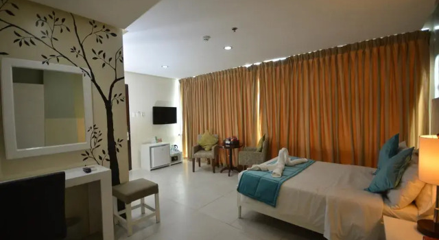 Номер Deluxe Holiday Suites Business District - formerly Empire Suites Hotel