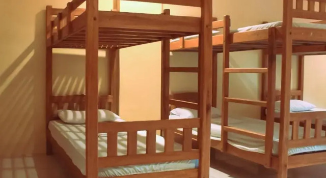 Кровать в общем номере The Waterfront Beach Resort