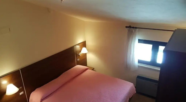 Четырёхместный номер Standard Дуплекс Hotel del Lago Ampollino