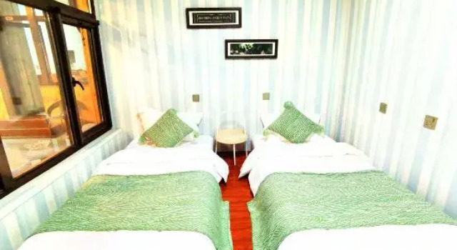 Кровать в общем номере Yuzhichen Light Luxury Holiday Homestay (Beijing Huairou Baihewan Scenic Area)