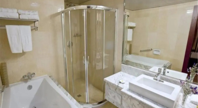 Номер Deluxe Jin Jiang Sun Hotel
