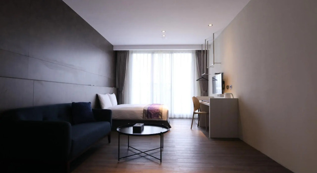 Кровать в общем номере Hotel Hesper HSR Taichung