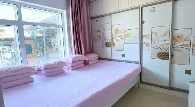 Кровать в общем номере Song Family Courtyard Hostel