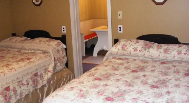 Standard quadruple chambre Swiss Chalets Motel