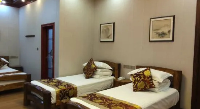 Кровать в общем номере Fulai Homestay