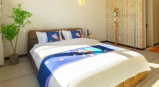 Кровать в общем номере Likuai Home International Style Boutique B&B
