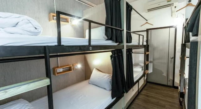 Кровать в общем номере Connect Hotel Chiang Rai