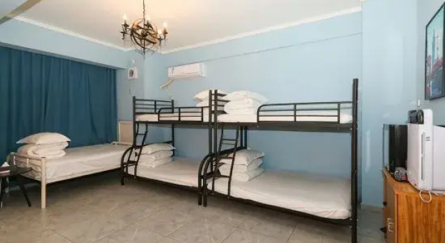 Кровать в общем номере Yunduo E-sports Hotel (Zhumadian Huanghuai College)