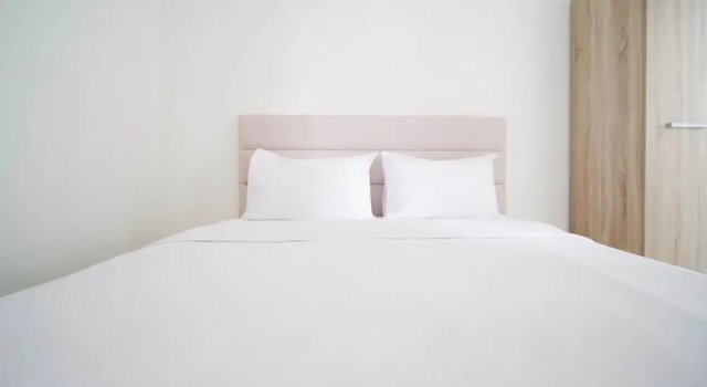 Studio Compact and Tidy Studio at Puncak Dharmahusada Apartment By Travelio