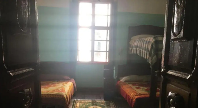 Кровать в общем номере Hostal La Chorrera
