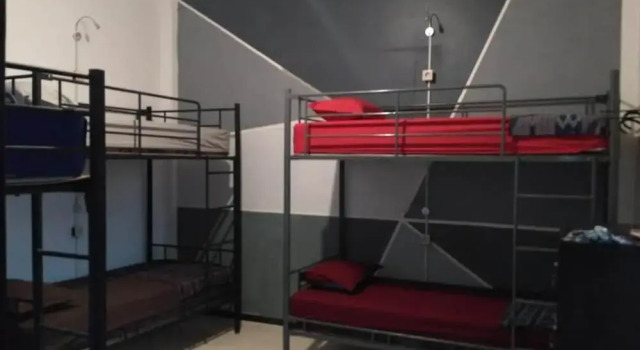 Łóżko w pokoju wieloosobowym Hati-Hati Homestay