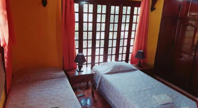 Кровать в общем номере Casa Inti Guesthouse & Lodge