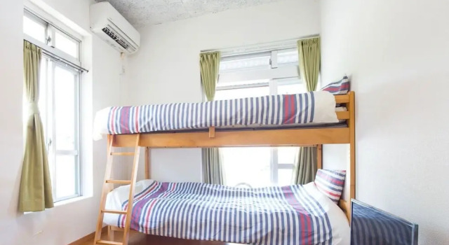 Кровать в общем номере Sun Green Resort Hotel Ishigaki