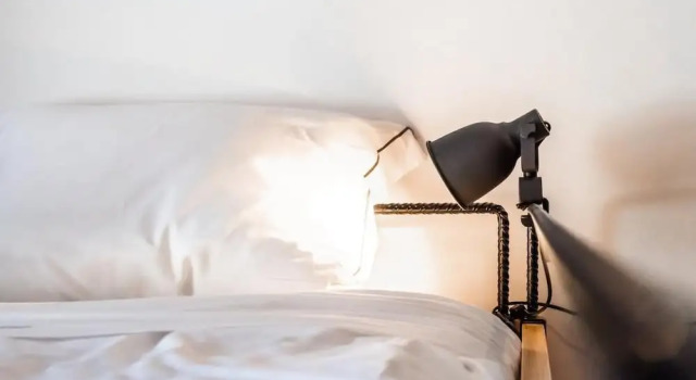 Postel ve společném pokoji Procyon Boutique & Suites