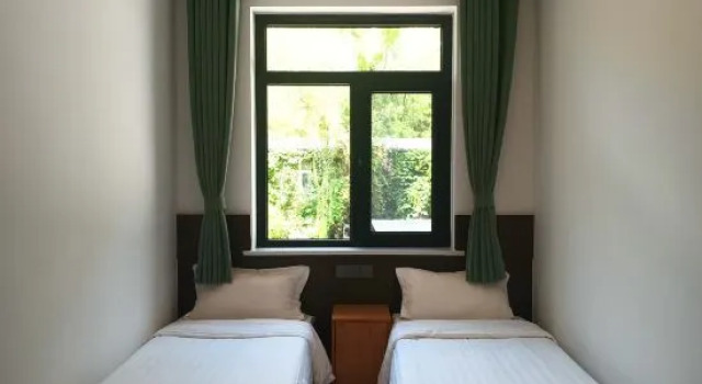 Кровать в общем номере Beijing Shentangxuan Tianlun Shengyuan Resort