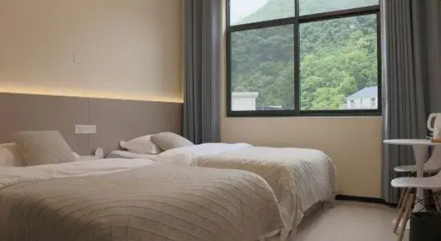 Трёхместный люкс Shitai Guniujiang Wangli B&B