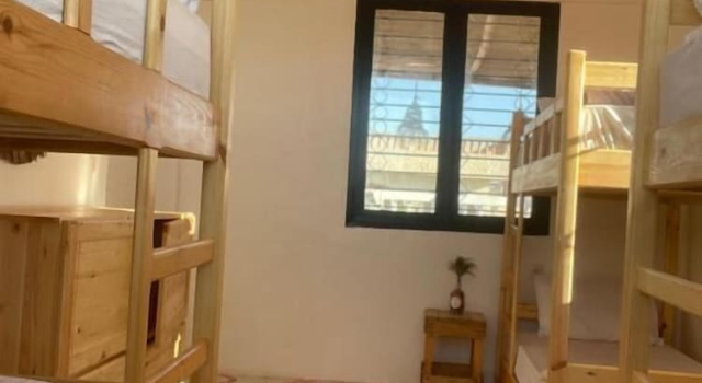 Кровать в общем номере рядом с пляжем Epicswellhouse