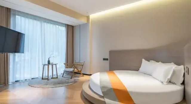 Кровать в общем номере с 6 комнатами Anji Yihai·YOHO Designer 360° Bamboo Sea Hot Spring Boutique Stay