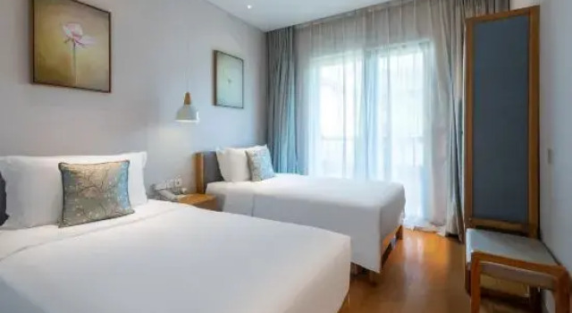 Трёхместный семейный люкс с 2 комнатами Nianhua Inn Wuxi Nianhuawan