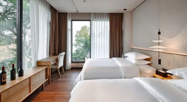 Кровать в общем номере с 2 комнатами Jushu Holiday Villa (Meilin Lake Store, Qingyuan)
