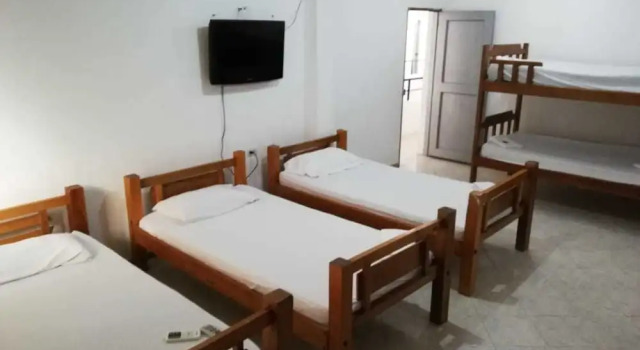 Кровать в общем номере Hotel cabañas de Tolu