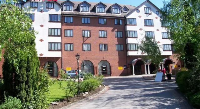 Кровать в общем номере Britannia Country House Hotel