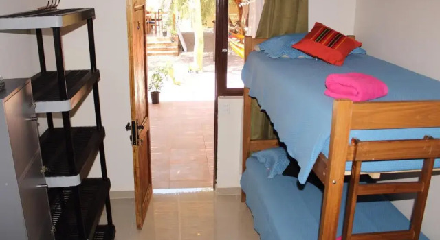 Кровать в общем номере Portal Andino Lodge