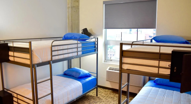 Кровать в общем номере Giorgio Hotel