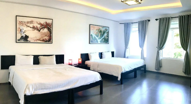 Кровать в общем номере Phu House