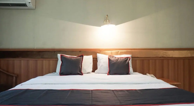 Номер Deluxe Puspiptek Residence Syariah Mitra RedDoorz