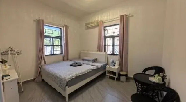 Люкс с балконом Xinsu Homestay (Judiaosha Yangmeikeng)