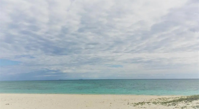 Кровать в общем номере Minshuku Seaside House Dugong