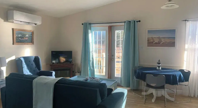 Коттедж с видом на закат Whispering Waves Cottages