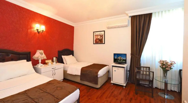 Трёхместный номер The Sunrise Hotel
