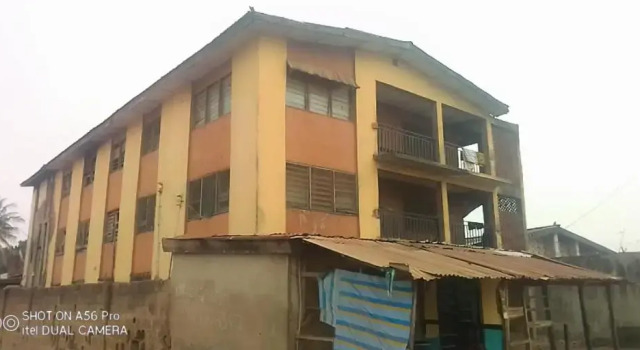 A 2-story building with 2 shops