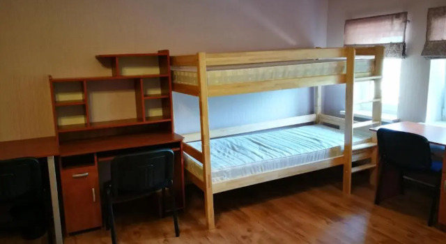 Кровать в общем номере Liela Guest Apartament