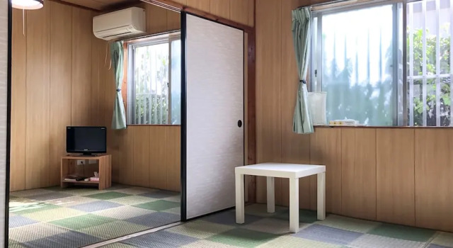 Кровать в общем номере Housei